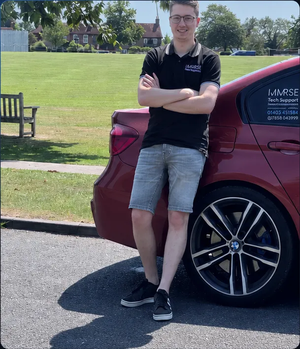 Temporary placeholder photograph of an Immrse engineer beside a branded support car